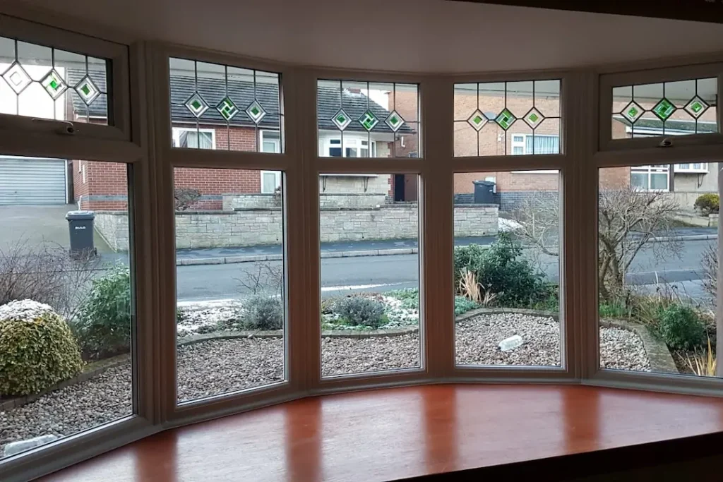 a room with a window and a view of a street